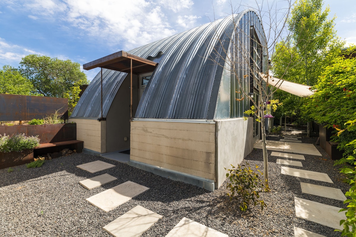 Cozy Santa Fe casita with warm lighting, local art, and outdoor seating