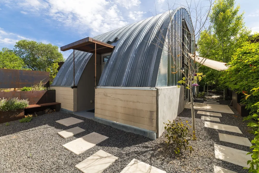 Cozy Santa Fe casita with warm lighting, local art, and outdoor seating